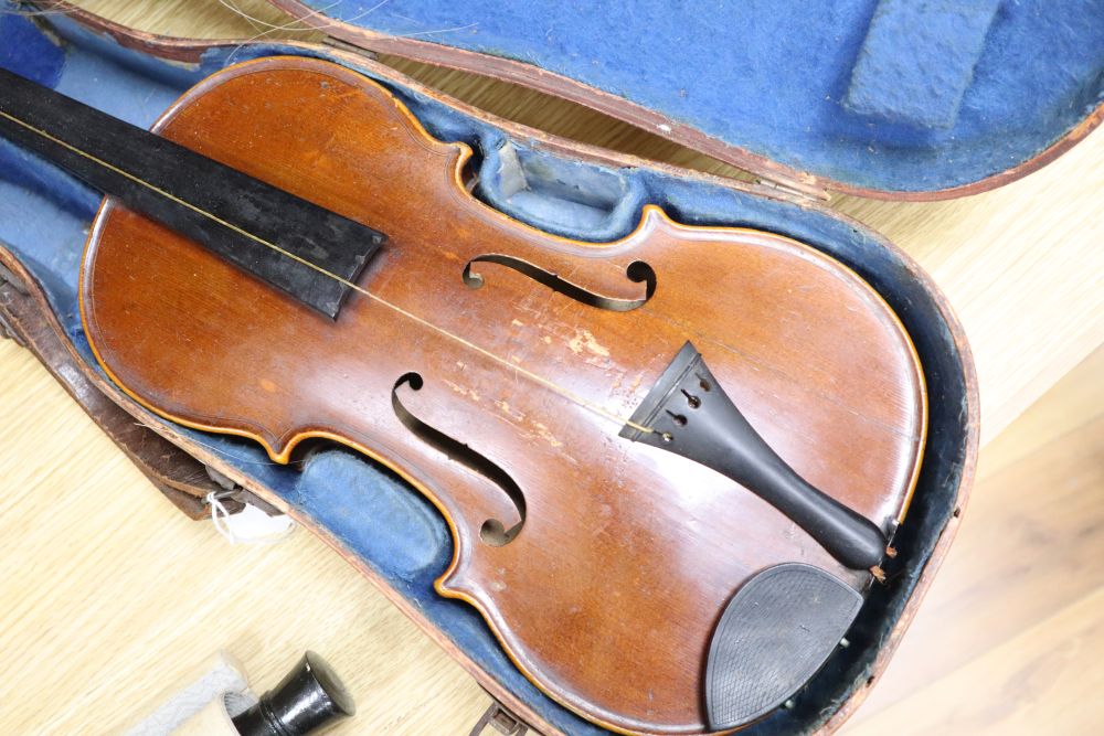 A cased violin, labelled Buthod, Paris, length of back 36cm, with bow stamped Tourte